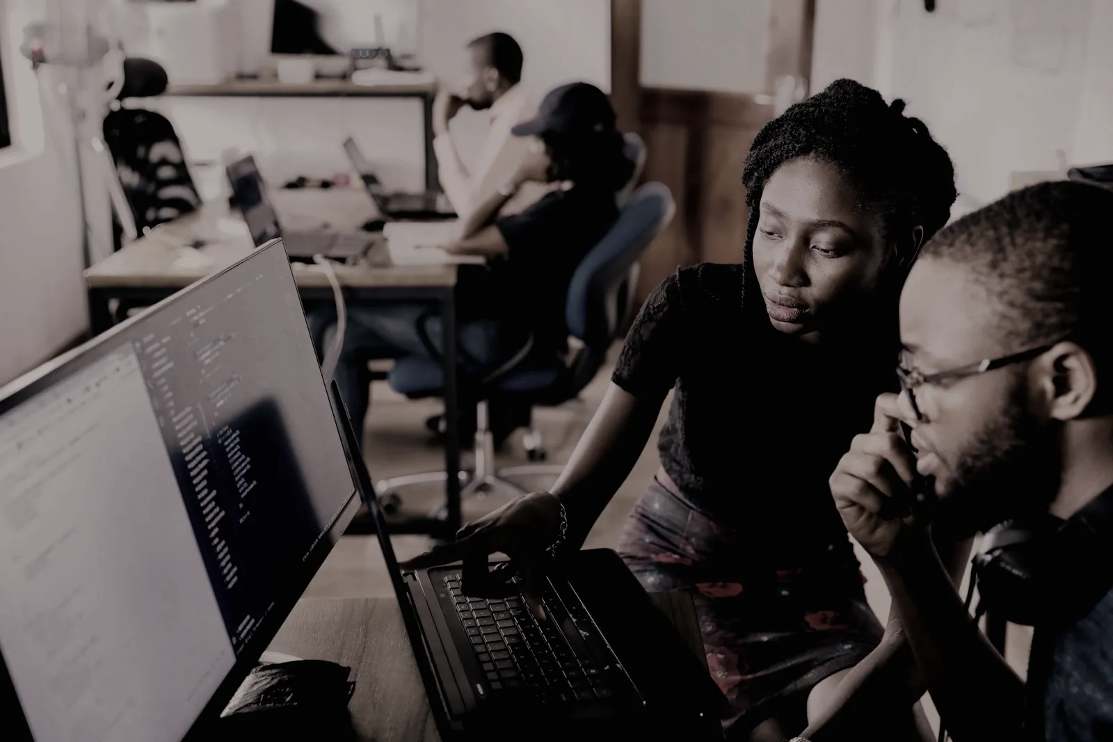A mentor and a learner reviewing code together
